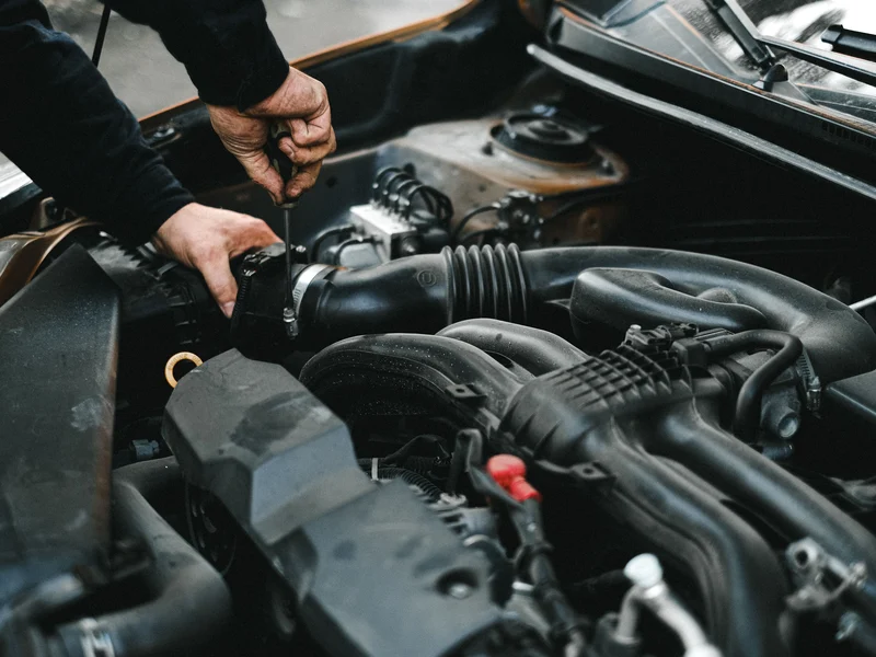 Auto technician making a precise repair in Chesapeake